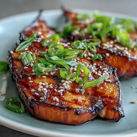 Silky Miso Glazed Eggplant, caramelized and sprinkled with sesame seeds.