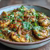 Golden-brown chicken thighs simmer in a creamy, fragrant Easy Chicken Curry sauce, ready to serve over fluffy basmati rice.