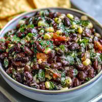 Vibrant 3-Ingredient Cowboy Caviar Dip with black beans, corn, and pico de gallo in a serving bowl.