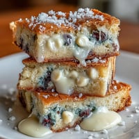 Chewy white chocolate lemon blueberry blondies dotted with fresh fruit and chips.